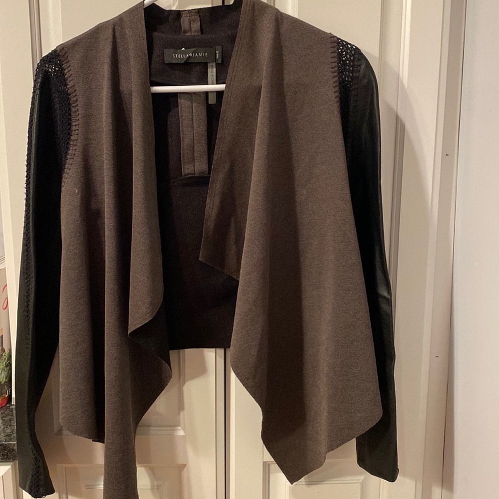 Nice blazer/ cardigan with pretty pleather details. Never worn.